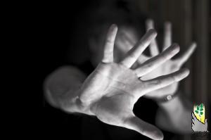 A young man trying to protect himself with his bare hands Hard contrast, cold colors, soft focus